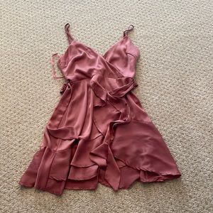 Pink Polly V cut dress with a removable sash